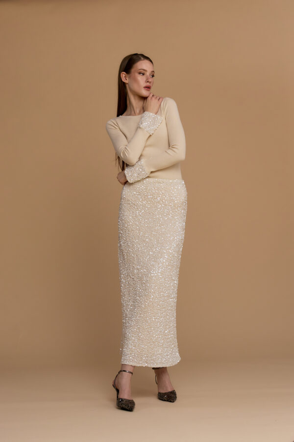 Knit top with sequin sleeve cuffs